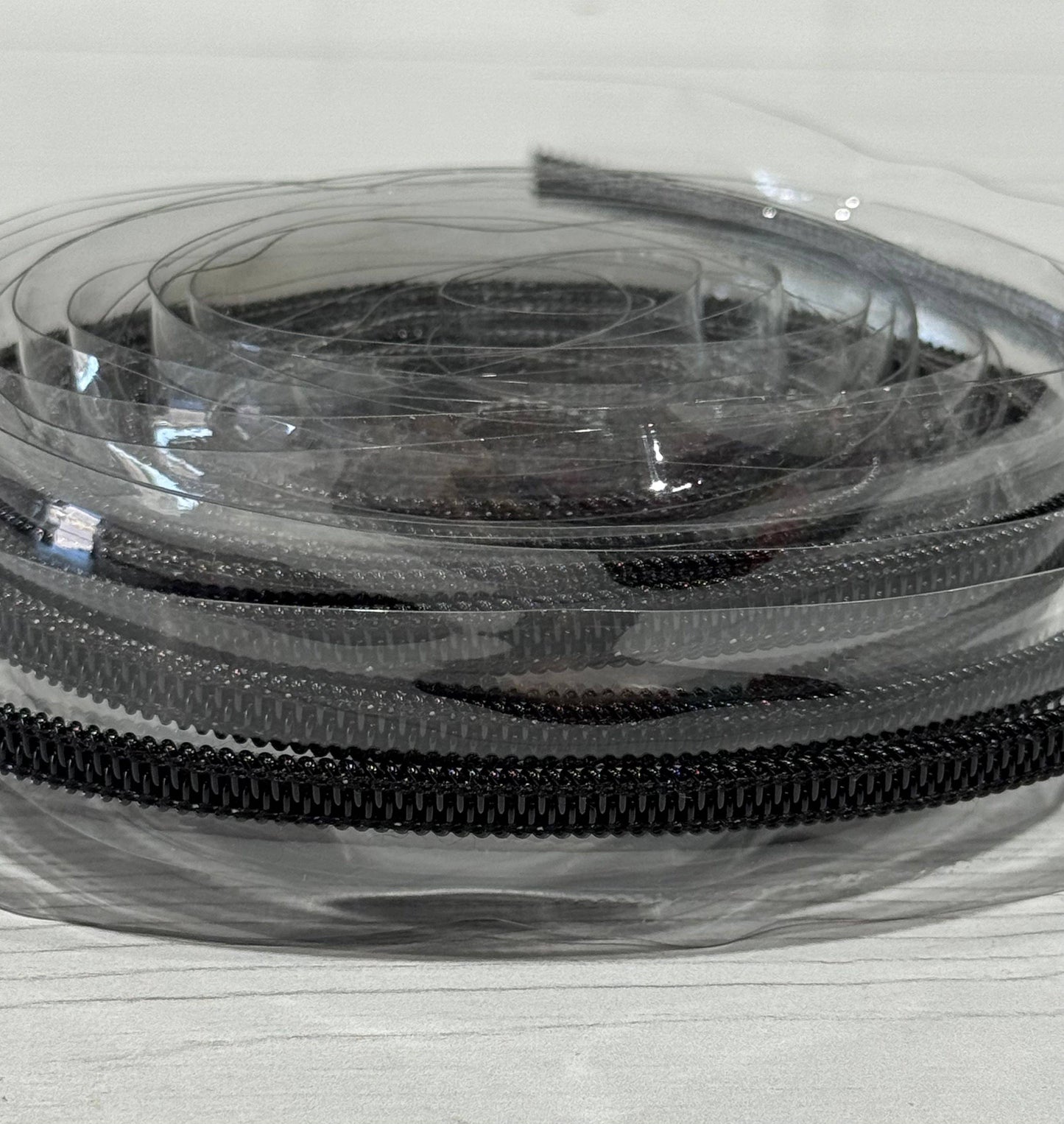 Wonderground Fabrics and Crafts - Clear zipper tape with Black teeth